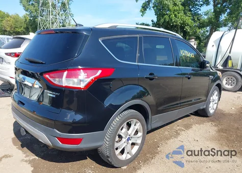 2016 Ford Escape Titanium z USA, uszkodzony, nr VIN 1FMCU9J91GUA95296